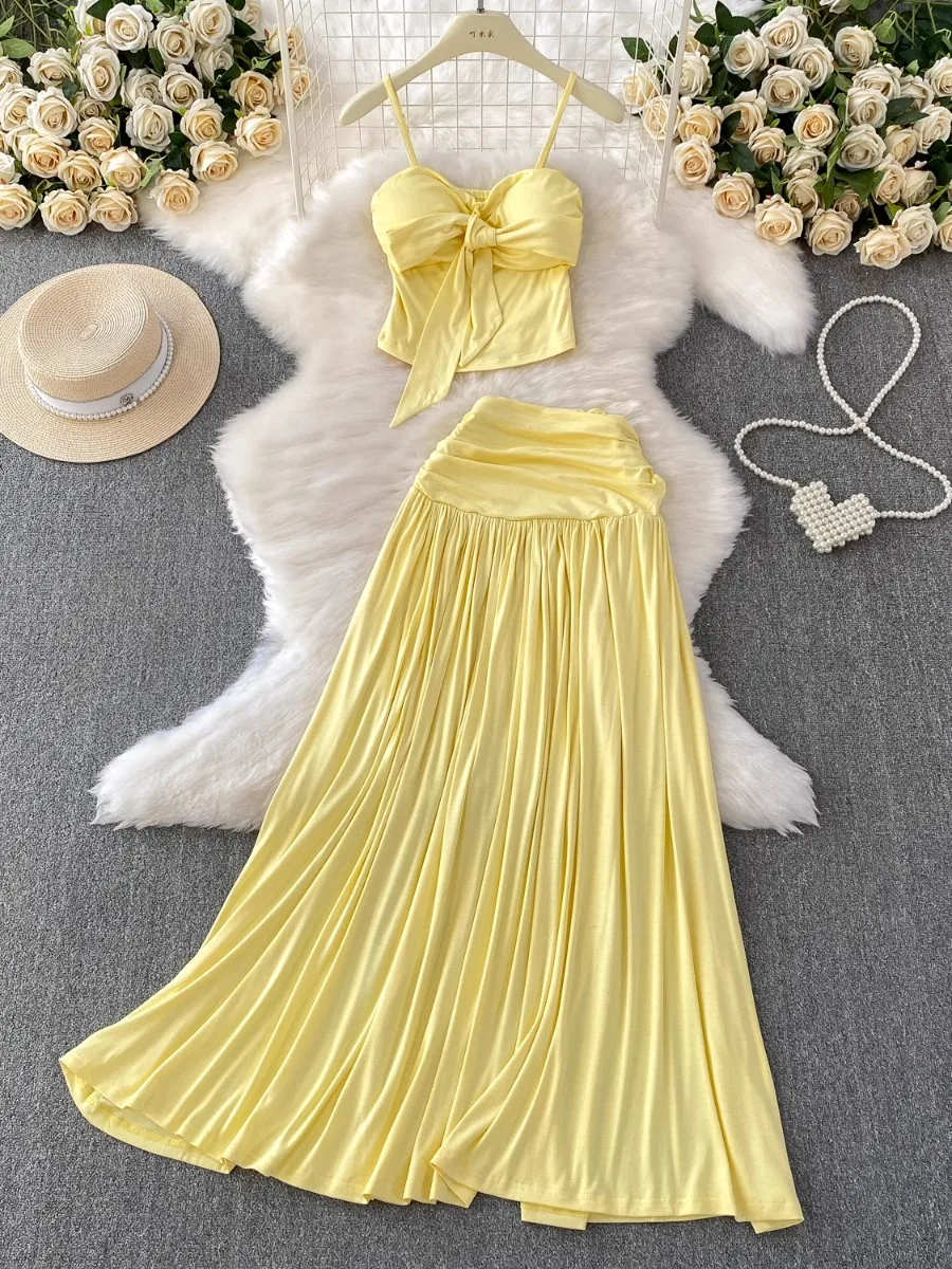 

Foamlina Yellow Sexy Tie Up Padded Bandeau Halter Top Set with High Waist Slim Fit Pleated Skirt Two Piece Skirt for Women