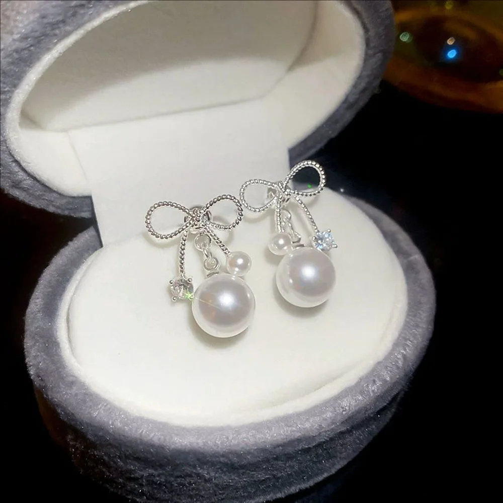 

Silvery-needle Zircon Bow Pearl Pendant Earrings Fashionable Studs Light Luxury And High-end Niche Jewelry For Women