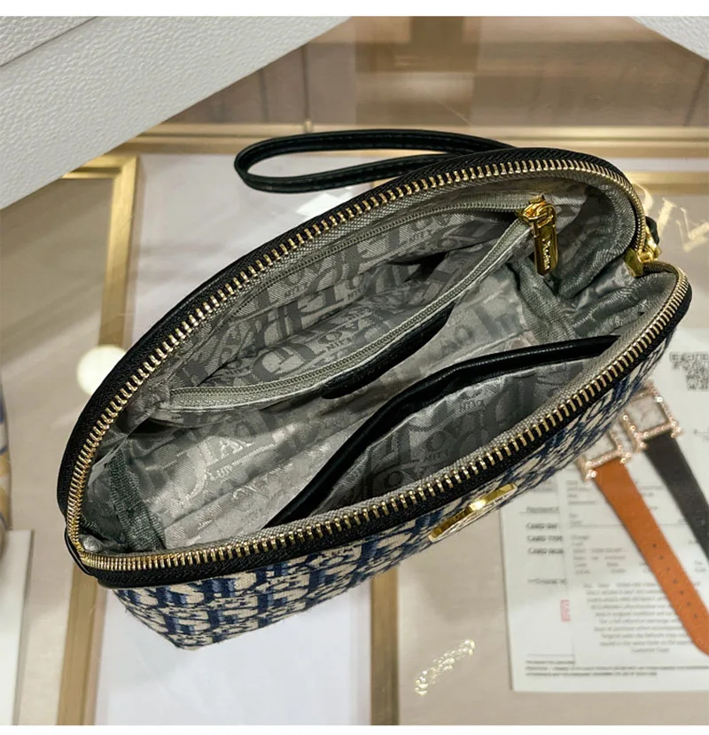 2023 Spring/summer new grip bag advanced sense embroidery printed makeup bag canvas texture hand purse M894