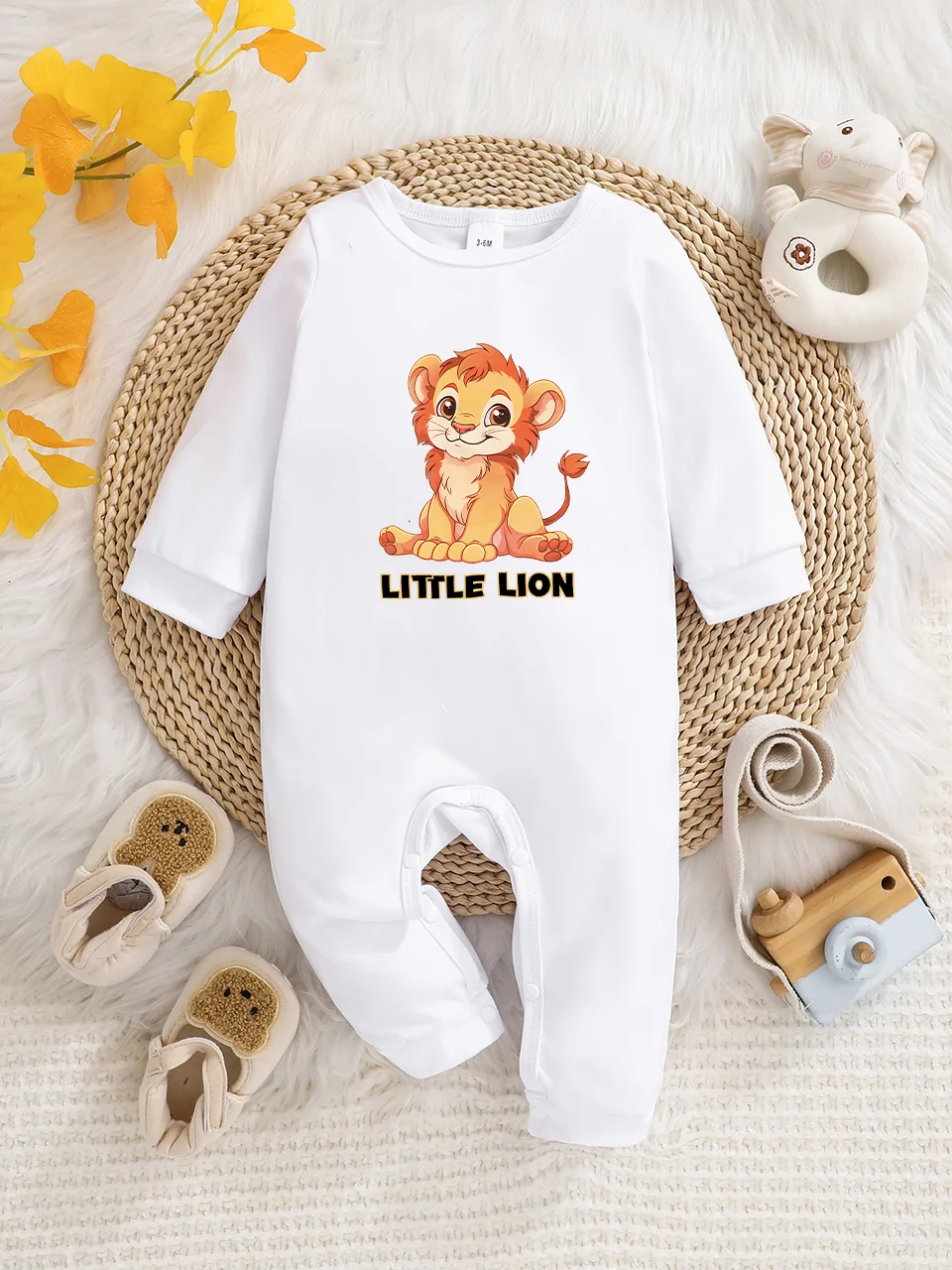 A baby long-sleeved onesie with interesting letter prints. It features a buttoned design for easy putting on and taking off