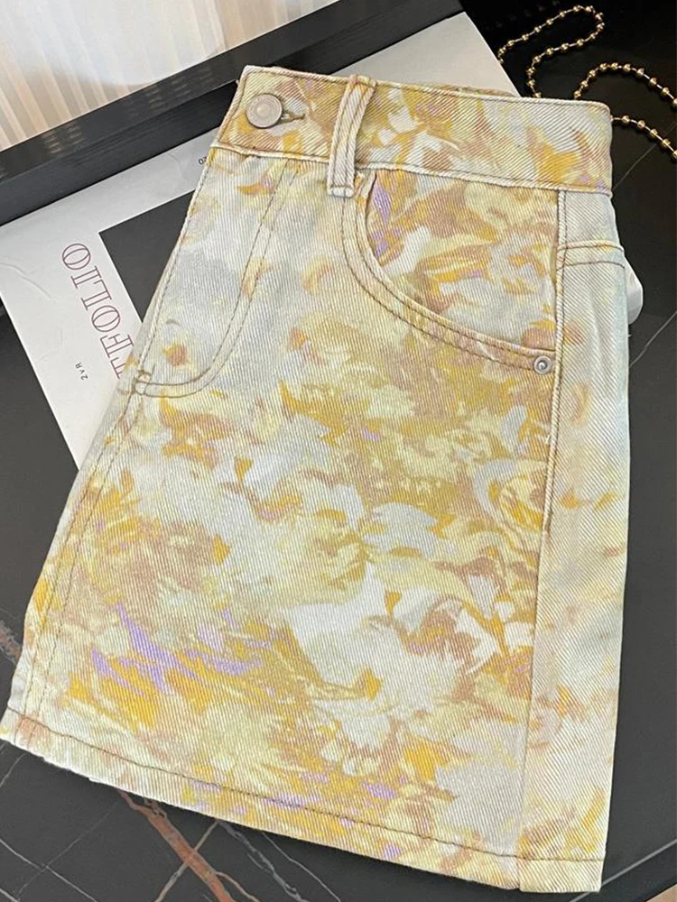 Novo coreano tie dye pintura a óleo impressão cintura alta a linha emagrecimento temperamento versátil meio corpo denim saia curta 2025