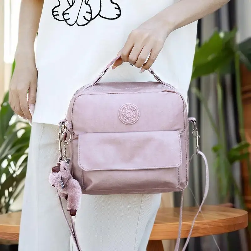 

Trend-Bound Casual Nylon Bag with Adorable Plush Monkey Pendant; Sports Crossbody Handbag