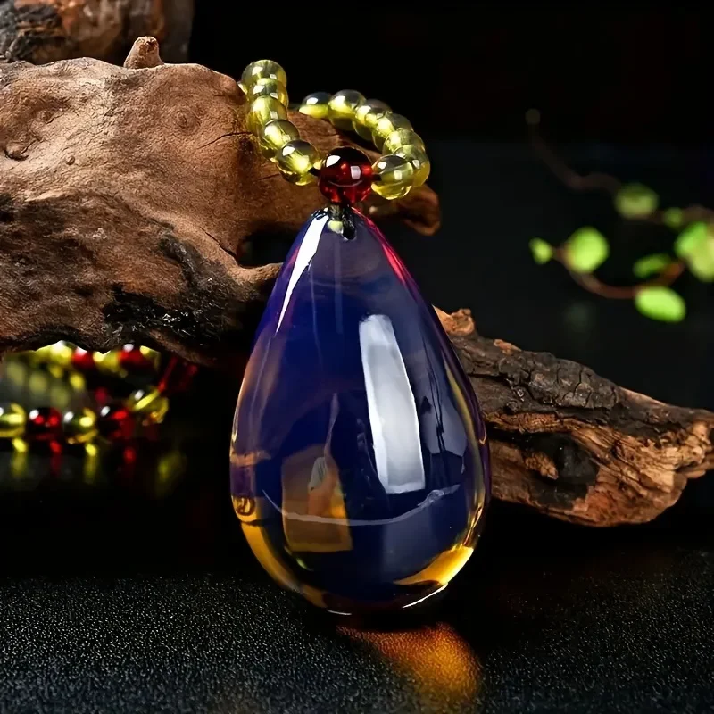

A Stylish Blue Amber Resin Water Drop Pendant Is Stylish and Simple for Both Men and Women