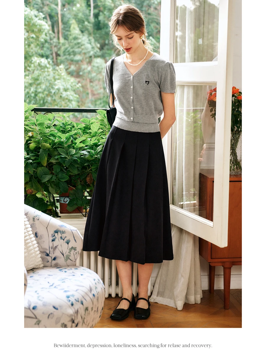 OLrain faldas plisadas negras para mujer 2025 otoño estilo Hepburn A-line Simple cintura alta botón señoras Midi falda N57CB96336
