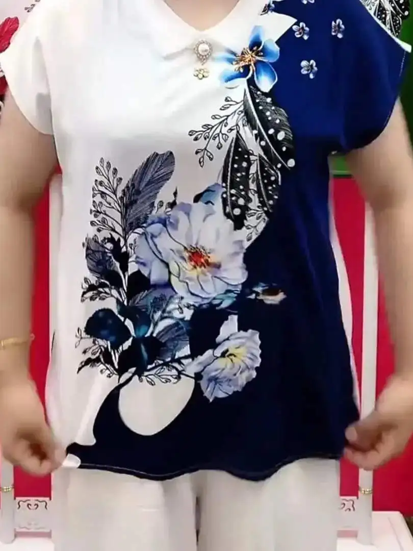 เสื้อยืดแฟชั่นผู้หญิง ฤดูร้อน รุ่นใหม่ ทรงหลวม ใส่แล้วดูผอม สไตล์ลำลอง คอตุ๊กตา พิมพ์ลายเกาหลี ดีไซน์สร้างสรรค์