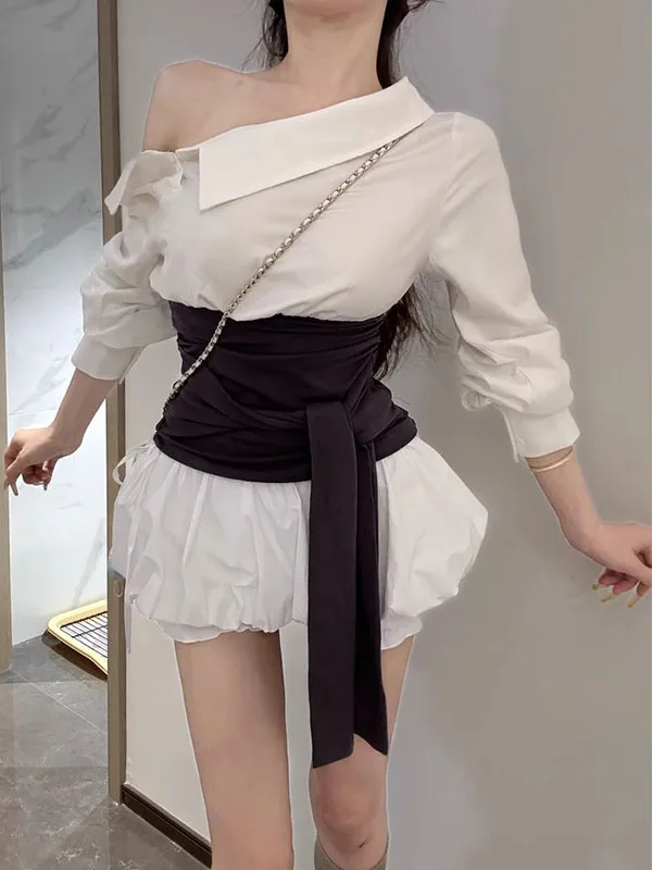 

Сексуальный летний комплект: топ с открытыми плечами и уникальным дизайном, подчеркивающим талию, и юбка-шорты с цветочным принтом.