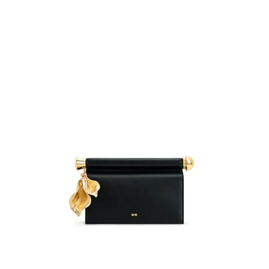 

Evening clutch with metal pendant embellishment, faux leather material, black color, elegant and versatile for formal occasions