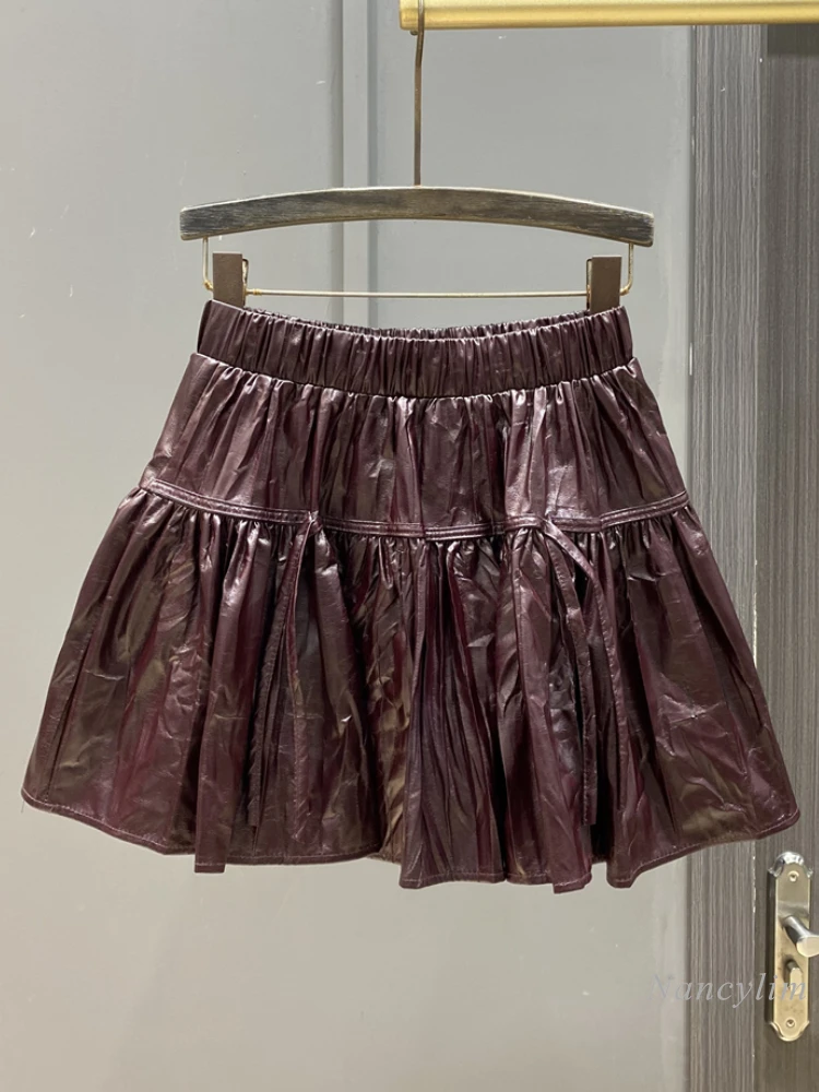 

2024 Autumn and Winter PU Leather Pleated Skirt A-shaped Skirt Strap Design Sense Age-reducing Temperament Short Skirts Women