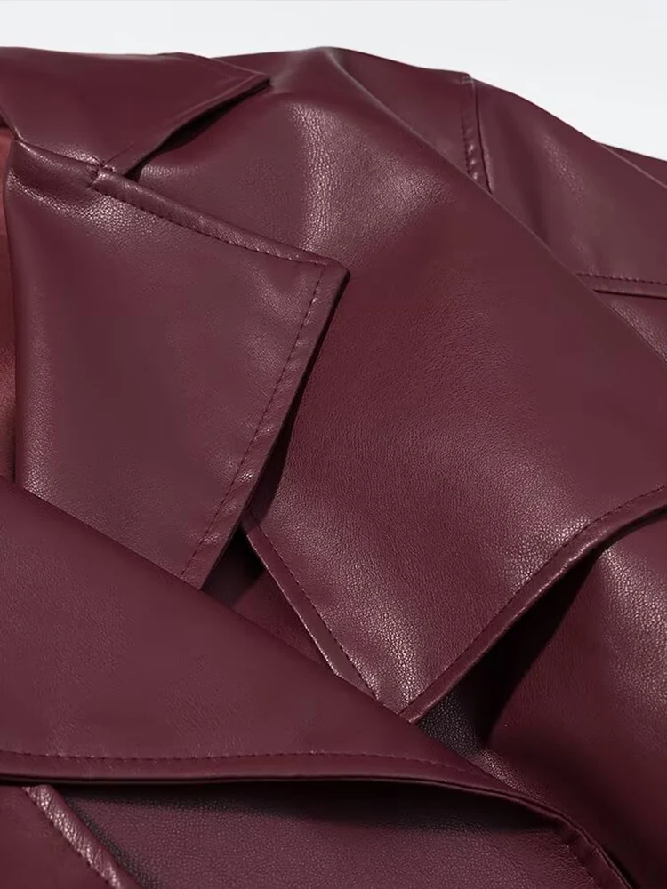 Nouvelle mode féminine de style européen : un manteau long en cuir polyvalent et élégant de couleur unie qui crée un effet minceur.