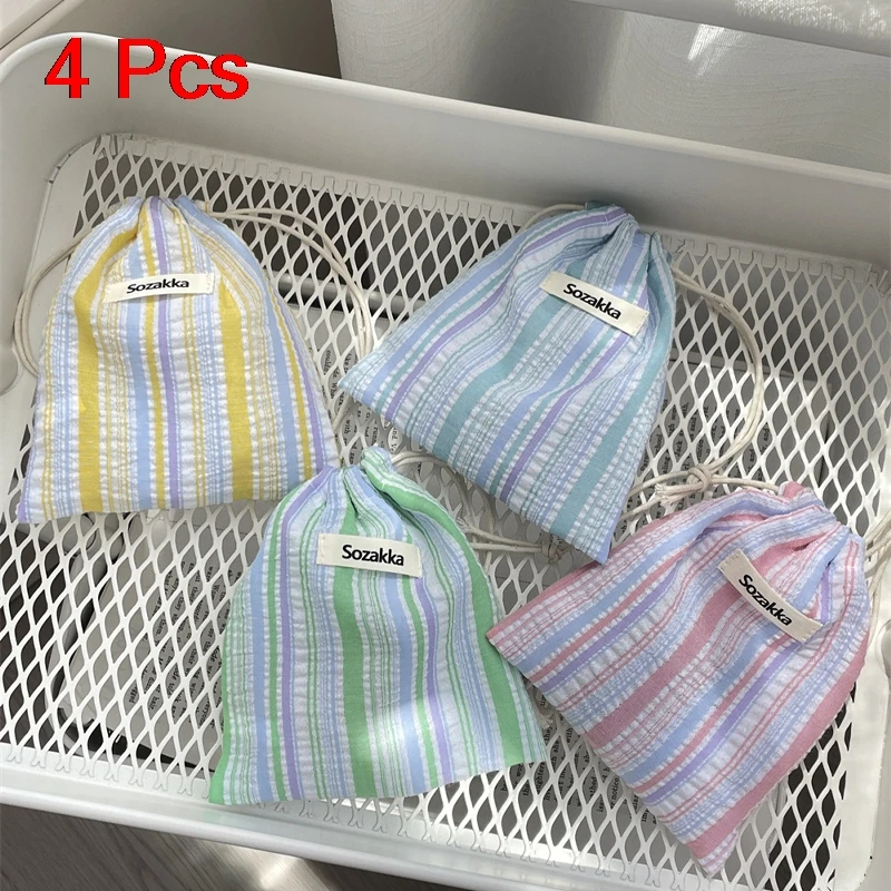 กระเป๋าแต่งหน้าของผู้หญิงญี่ปุ่นจีบลายเชือกรูดกระเป๋าแบบพกพาขนาดกะทัดรัดกระเป๋าเดินทางธุรกิจกระเป๋าเครื่องสำอางสำหรับสาว