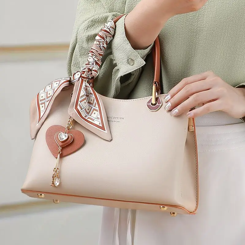

2026 Women Classic Genuine Leather Handbag Fashion Lady Heart Pendant Top Tote Bag Elegant Mother Daily Commute Crossbody Bags