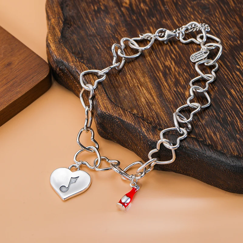 

Genuine 925 sterling silver Connected Hearts Charm Bracelet paired with Joyful melody Spicy sauce pendant