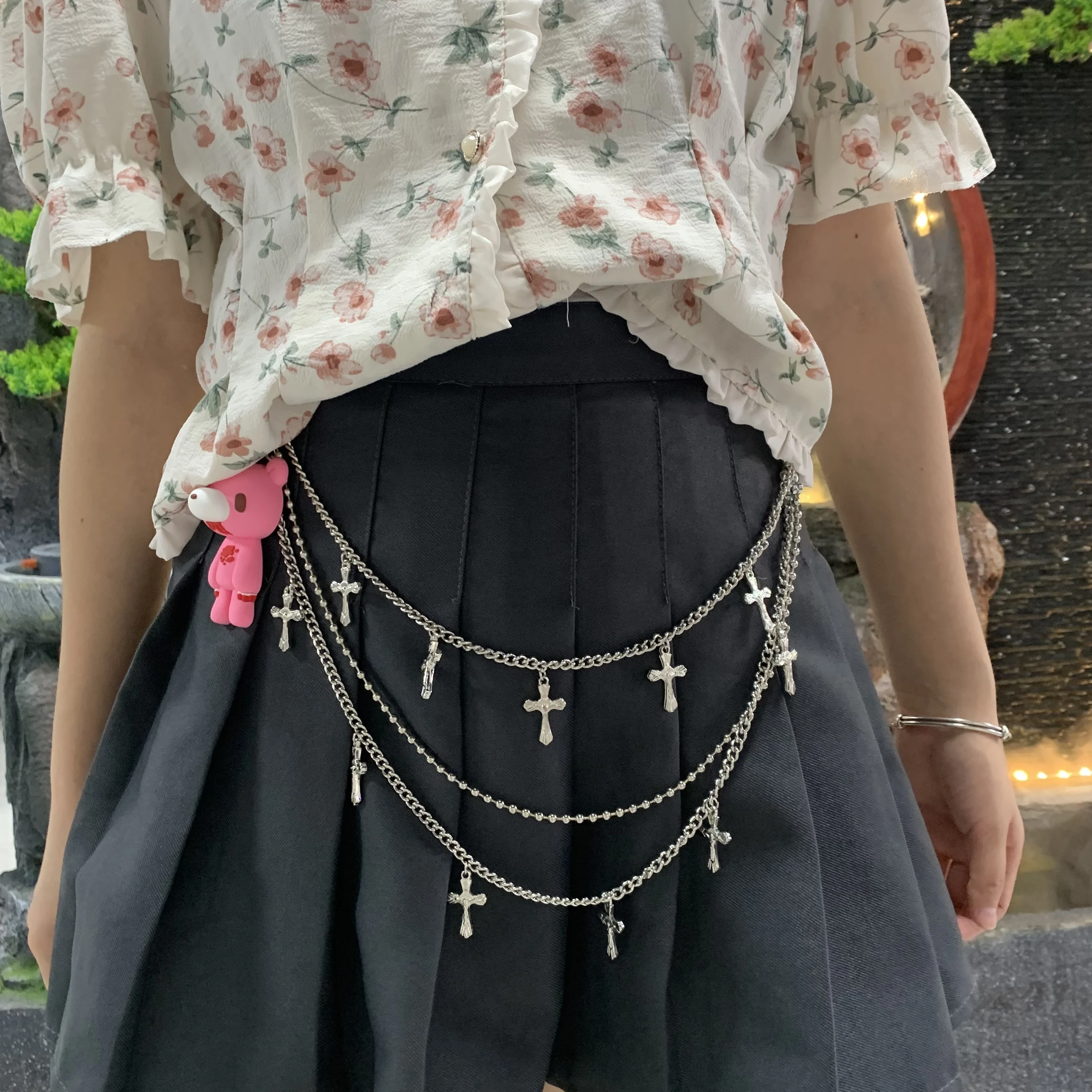 

Gloomy Bear waist chain: Pink bear pendant, layered silver chains with crosses. Cute - edgy, elevates outfits.