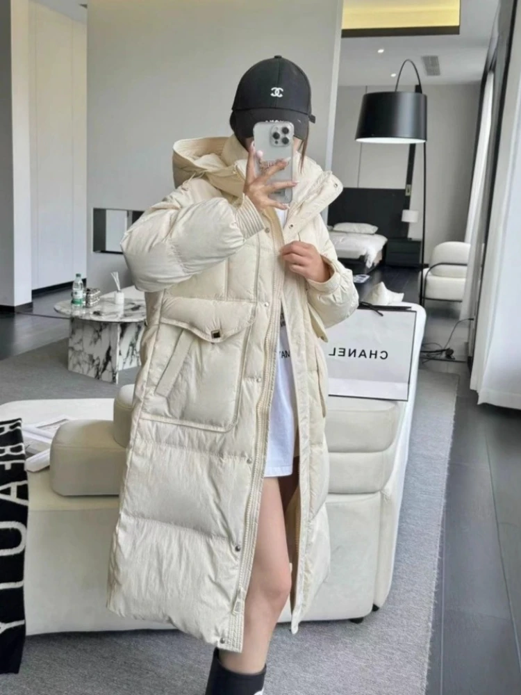 Piumino lungo invernale 2025New Coreano di alta qualità con cappuccio sciolto resistente al freddo Parka da donna addensare caldo piumino d'anatra bianco