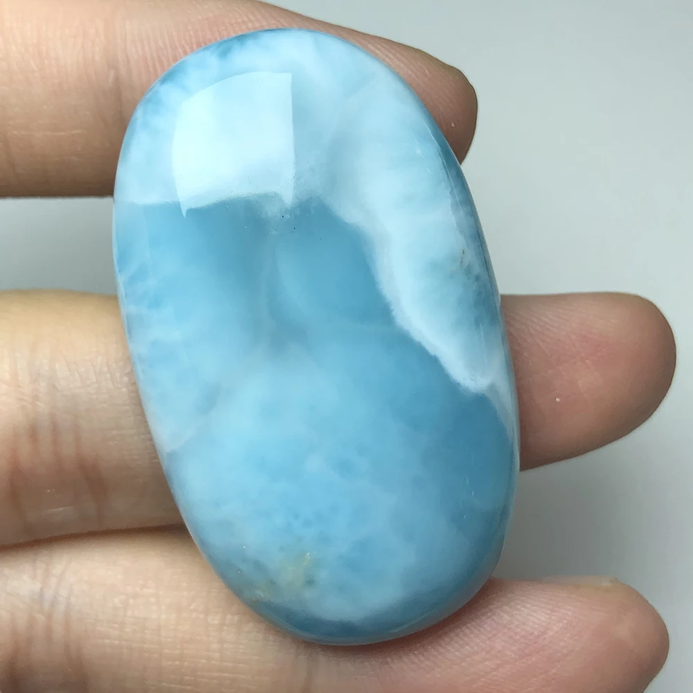 

Natural larimar stone pendant, rough loose stone, 25.68 gram, big oval 29mm*48.6mm, deep blue color, used for pendant