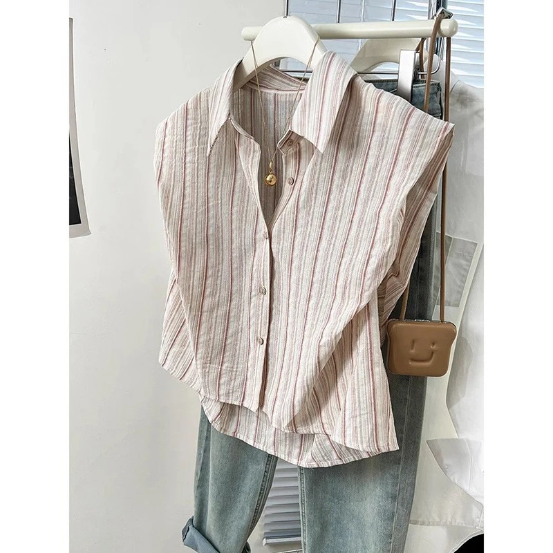 Camicia a righe asimmetrica allentata con bottoni alla moda Abbigliamento femminile 2025 Estate Nuove magliette casual Camicetta da donna senza maniche da ufficio
