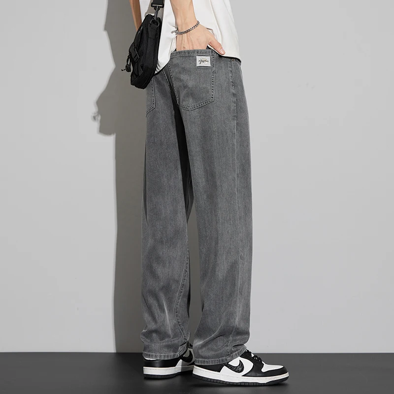 2025 Lyocell verano pantalones vaqueros finos de los hombres de cintura alta sueltos cómodos rectos elásticos pantalones vaqueros de negocios pantalones masculinos