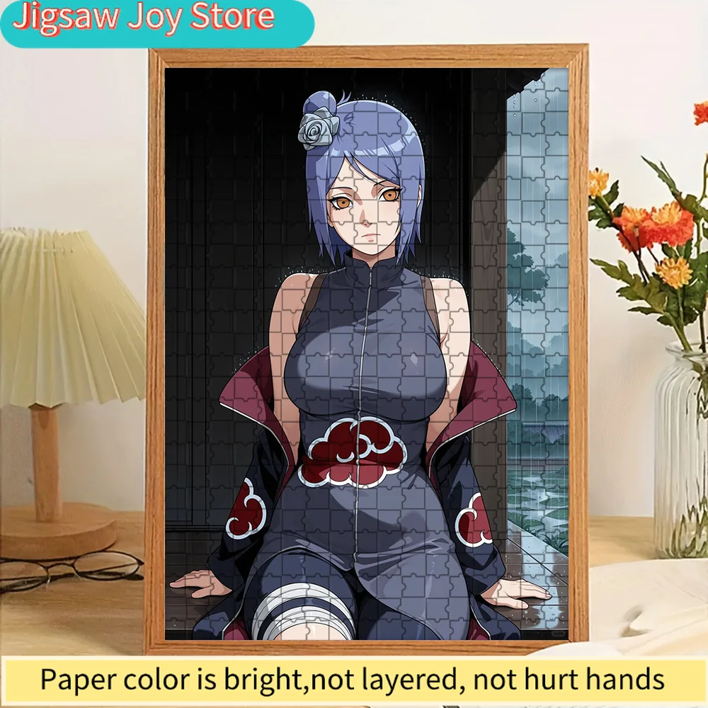 

High Quality Paper Jigsaw Puzzle Anime Konan in Akatsuki Dress with Open Cloak Sitting on Wooden Floor with Rainy Window View Vi