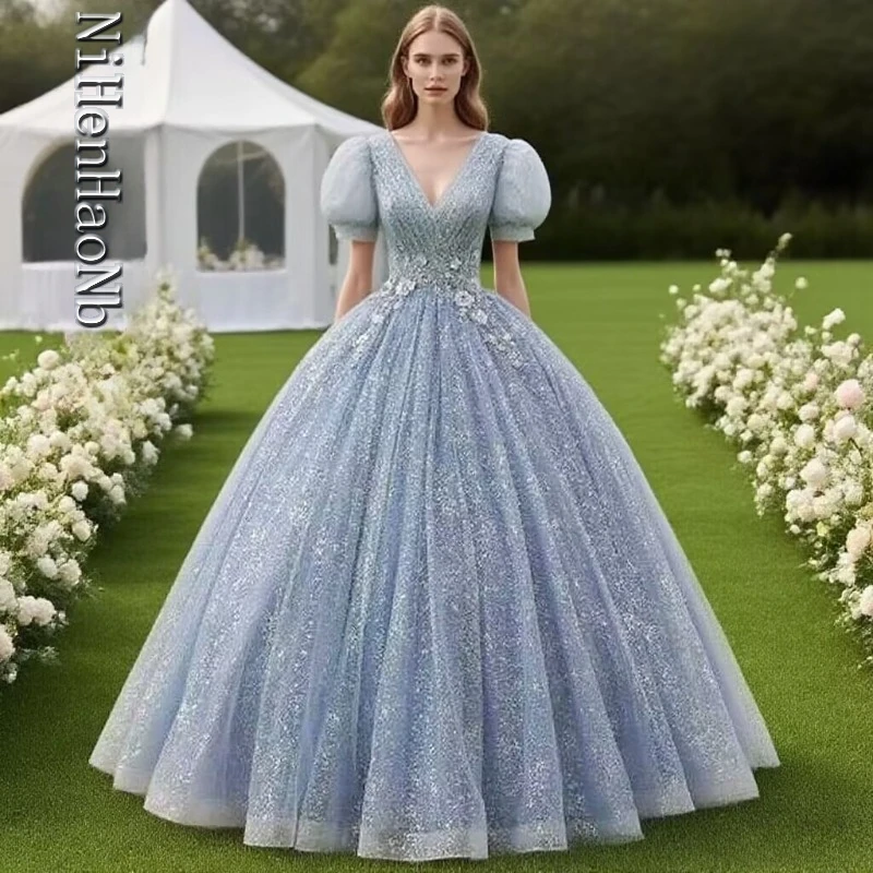 

Light Blue Glittery Ball Gown with Puff Sleeves V-Neck and Floral Waist Embellishments A Captivating Quinceanera Dresses