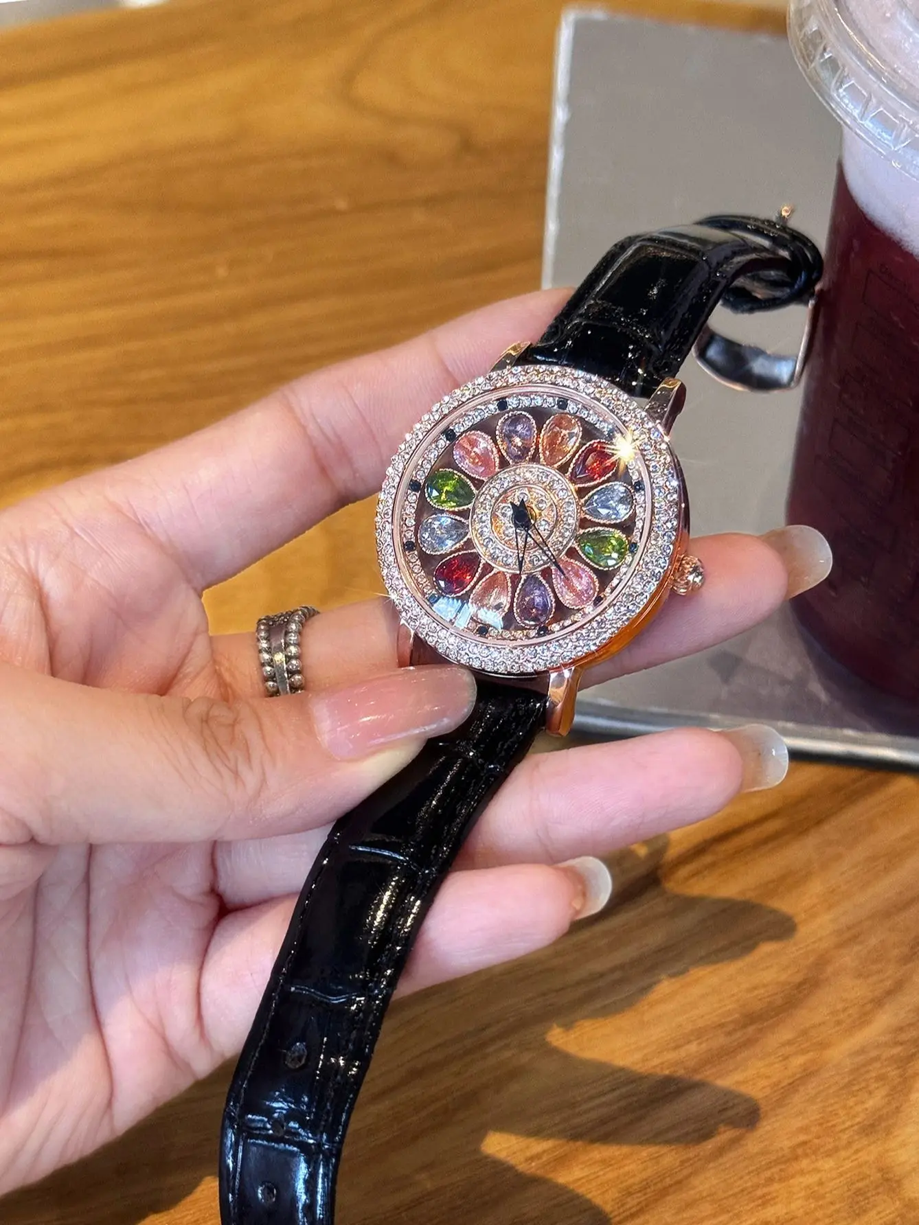 1 new colorful fashion elegant ladies quartz watch rotating dial inlaid with colored diamond and black leather strap elegant literary leisure simple niche ladies waterproof watch suitable for daily we