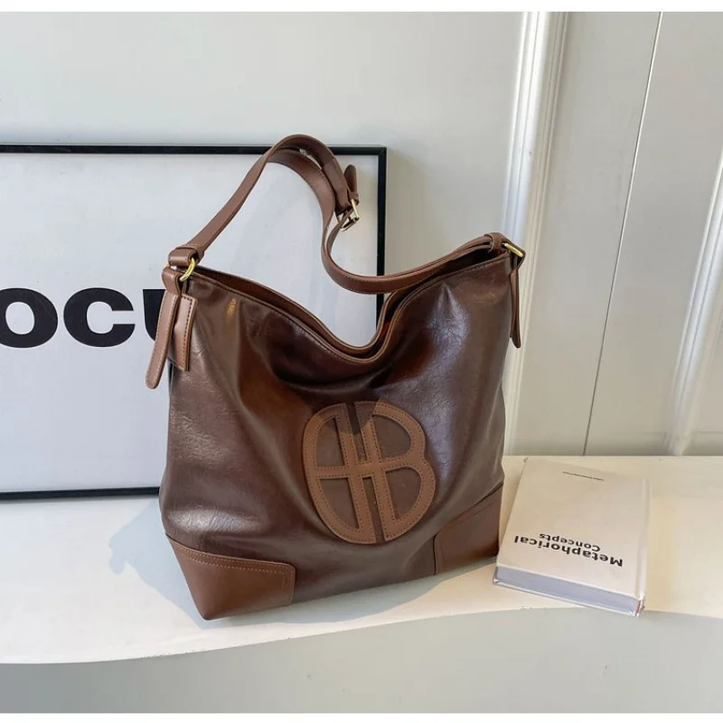 

Роскошная женская большая сумка из тонкой кожи с повседневным знаменитым прочным повседневным образцом ​