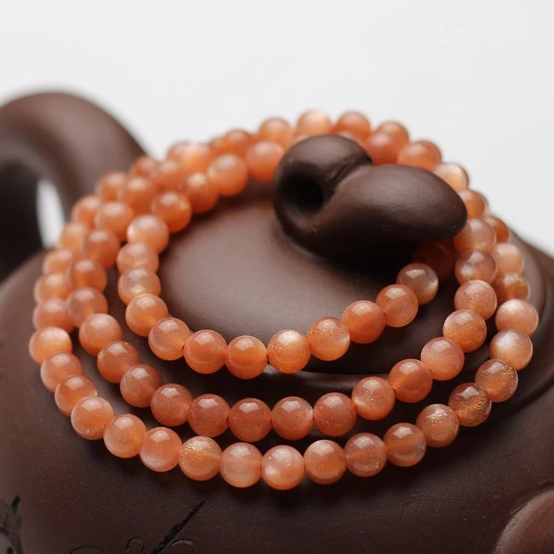 

Natural Multi- , Three-Loop Orange Moonlight Gold Sand'S Eye Sunstone , Bead Bracelet