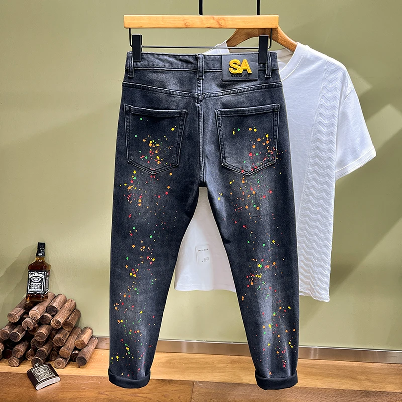 2024 spring and summer trend of fashion printing spray paint jeans men's Slim small straight leg pants personalized hole pants