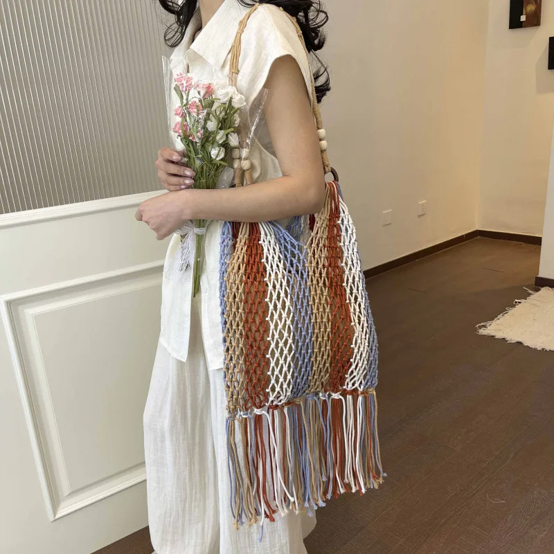 

Ethnic style lazy woven cotton rope fringed portable shoulder hollow beach color matching casual tote bag