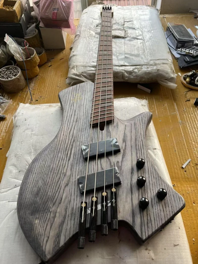 

High quality 4 string headless electric bass,Rosewood scalloped fingerboard，Maple 5 piece neck，Active electronics，Free delivery