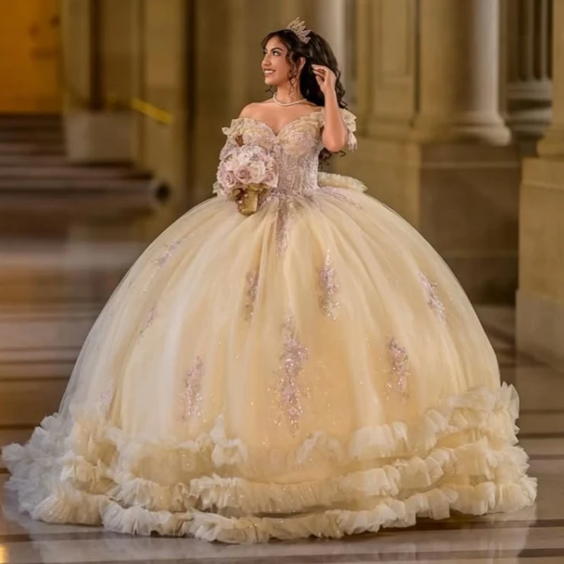 

Champagne Shiny Ball Gown Quinceanera Dresses Off The Shoulder Applique Lace Tiered Tull Beading Bow Corset Party Birthday Sweet