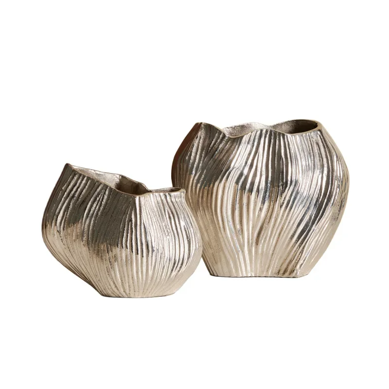 

Simple modern abstract irregular silver aluminum flower ware, high-end vase on the desktop in the living room model room, decora