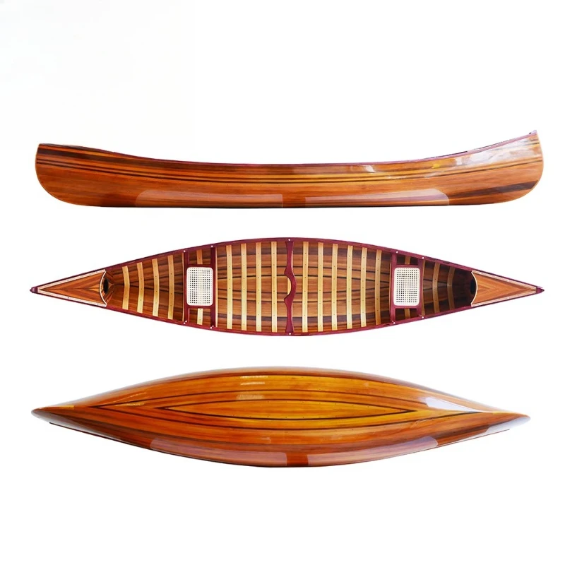 

Handcrafted cedar strip canoe with curved bow and paddle inflatable fiberglass kayak lake fishing wooden boat