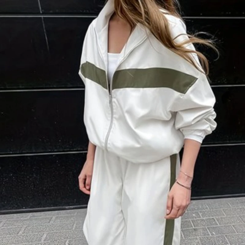 

Модный одинаковый спортивный женский костюм, повседневный, новинка 2025, осенняя лоскутная цветная куртка + эластичные брюки с высокой талией для женских комплектов