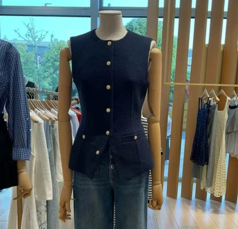 Elegancka damska kamizelka bez rękawów z okrągłym dekoltem, dopasowany krój, jednorzędowa, z kieszenią.