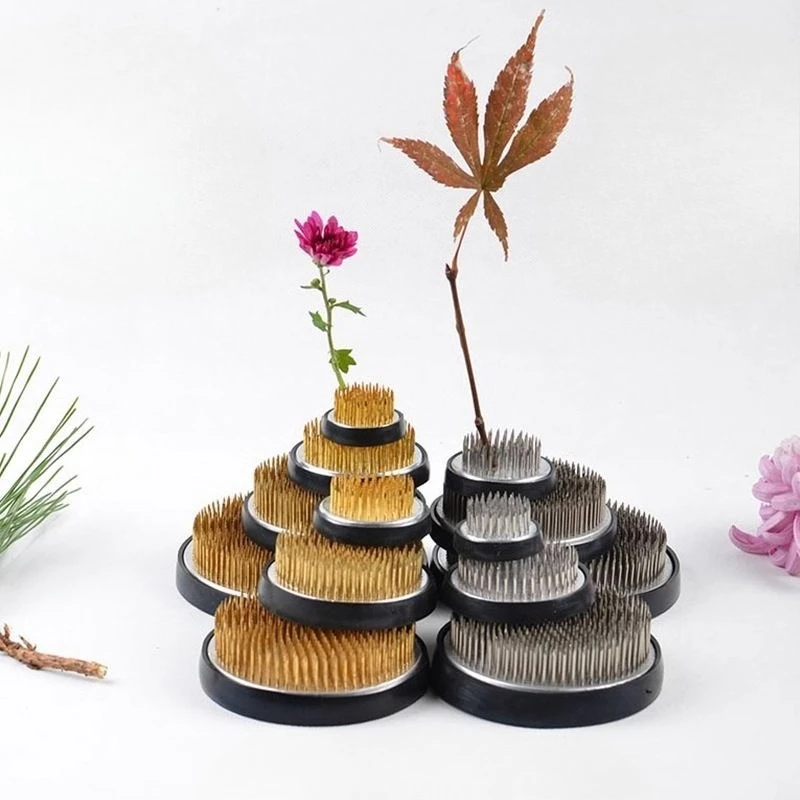 Π―ΠΏΠΎΠ½ΡΠΊΠ°Ρ Ikebana, ΠΌΠ΅ΡΠ°Π»Π»ΠΈΡΠ΅ΡΠΊΠΎΠ΅ ΠΊΡΡΠ³Π»ΠΎΠ΅ ΠΊΠΎΠ»ΡΡΠΎ Kenzan, ΠΈΠ½ΡΡΡΡΠΌΠ΅Π½Ρ Π΄Π»Ρ ΠΎΡΠ½ΠΎΠ²Π°Π½ΠΈΡ ΡΠ²Π΅ΡΠΎΠ², ΠΏΡΠΈΡΠΏΠΎΡΠΎΠ±Π»Π΅Π½ΠΈΠ΅ Π΄Π»Ρ Π²ΡΡΠ°Π²ΠΊΠΈ ΡΠ²Π΅ΡΠΎΠ² Π―ΠΏΠΎΠ½ΡΠΊΠ°Ρ Ikebana, ΠΌΠ΅ΡΠ°Π»Π»ΠΈΡΠ΅ΡΠΊΠΎΠ΅ ΠΊΡΡΠ³Π»ΠΎΠ΅ ΠΊΠΎΠ»ΡΡΠΎ Kenzan, ΠΈΠ½ΡΡΡΡΠΌΠ΅Π½Ρ Π΄Π»Ρ ΠΎΡΠ½ΠΎΠ²Π°Π½ΠΈΡ ΡΠ²Π΅ΡΠΎΠ², ΠΏΡΠΈΡΠΏΠΎΡΠΎΠ±Π»Π΅Π½ΠΈΠ΅ Π΄Π»Ρ Π²ΡΡΠ°Π²ΠΊΠΈ ΡΠ²Π΅ΡΠΎΠ²