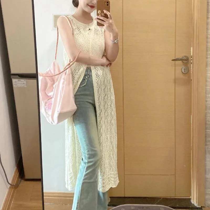 ชุดเดรสชายหาดกลวงออก สาวเผ็ดยุโรปและอเมริกา ทรงยาว คอกลม สไตล์แขนกุด เสื้อสเวตเตอร์ถัก กระโปรงเสื้อกั๊ก