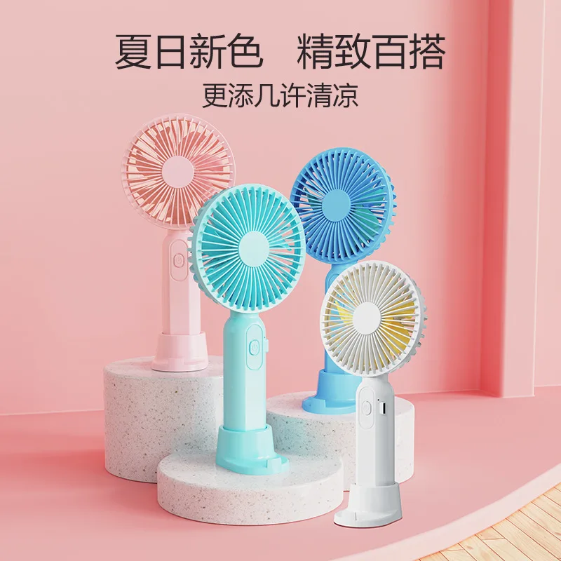 New hand-held mini fan wholesale USB rechargeable desktop household student dormitory mute electric fan.