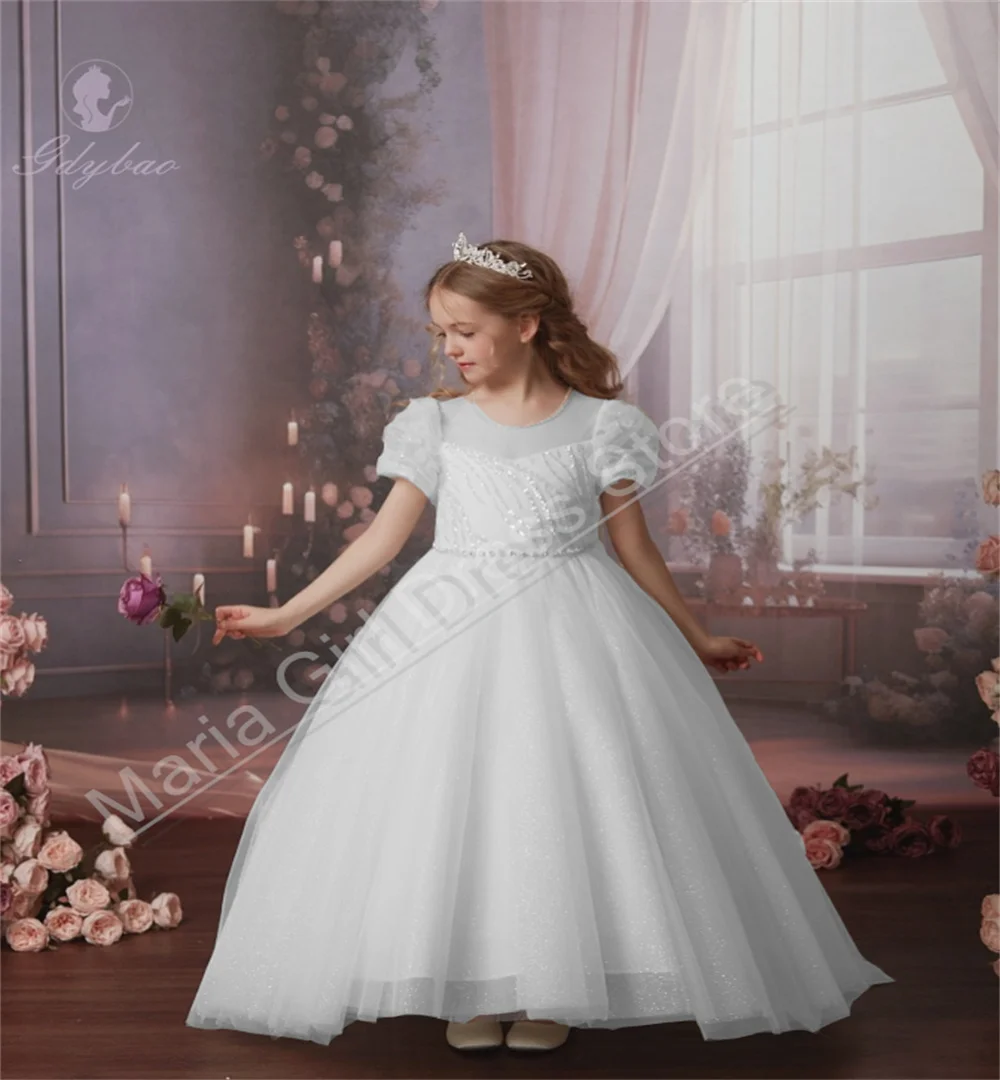 Eleganckie sukienki dla dziewczynek sypiących kwiatki, długie, prześwitujące, z okrągłym dekoltem, idealne na konkursy piękności, sakramenty, wesela i przyjęcia.