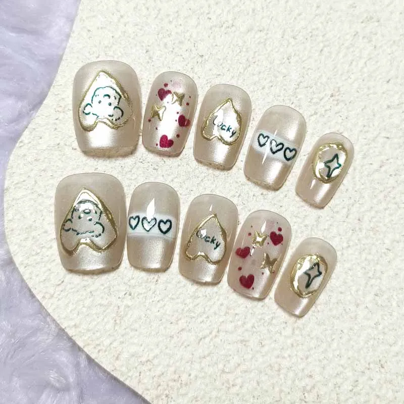 10 ชิ้นน่ารักการ์ตูนหัวใจสีทองและสุนัขกดบนเล็บสไตล์ฝรั่งเศส Polka Dot Bowknot เล็บที่ถอดออกได้ Cat Eye Design เล็บ