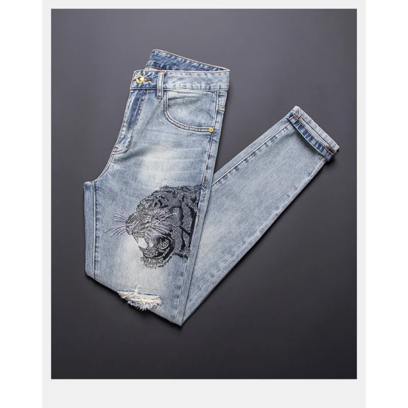 

Tiger head rhinestone print fashionable light luxury jeans for men 2025 new trendy brand slim fit small leg ripped pants