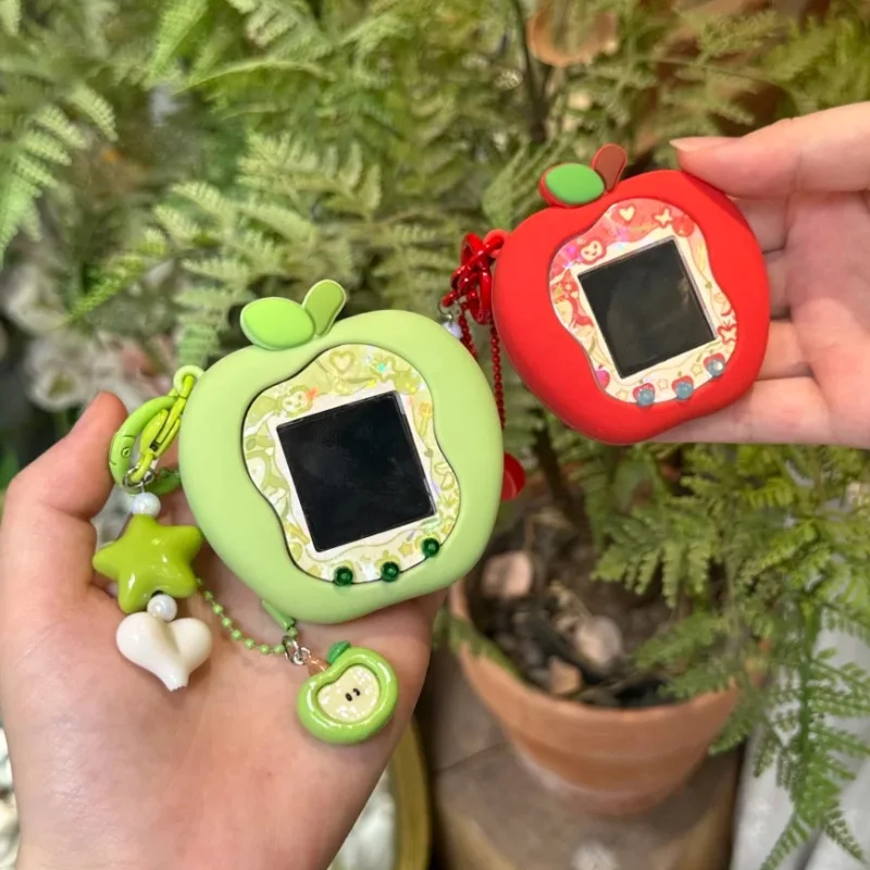 حافظة حماية من السيليكون من Tamagotchi Uni Smart Uni Pet Machine باللون الأخضر والأحمر Apple Uni مع أوراق لوحة وسلاسل المفاتيح وهدايا عيد الميلاد