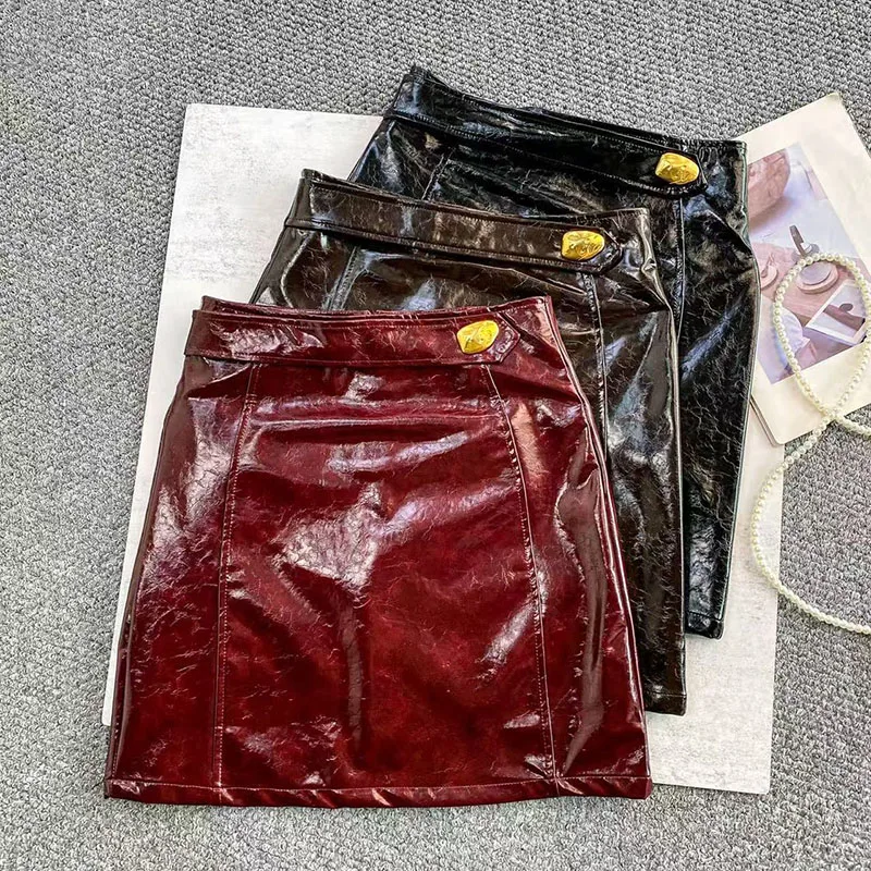 

Vintage PU Leather Skirt High Waist Metal Button Zipper Design Female Spicy Girl Trendy Clubwear Mini Bodycon Skirt