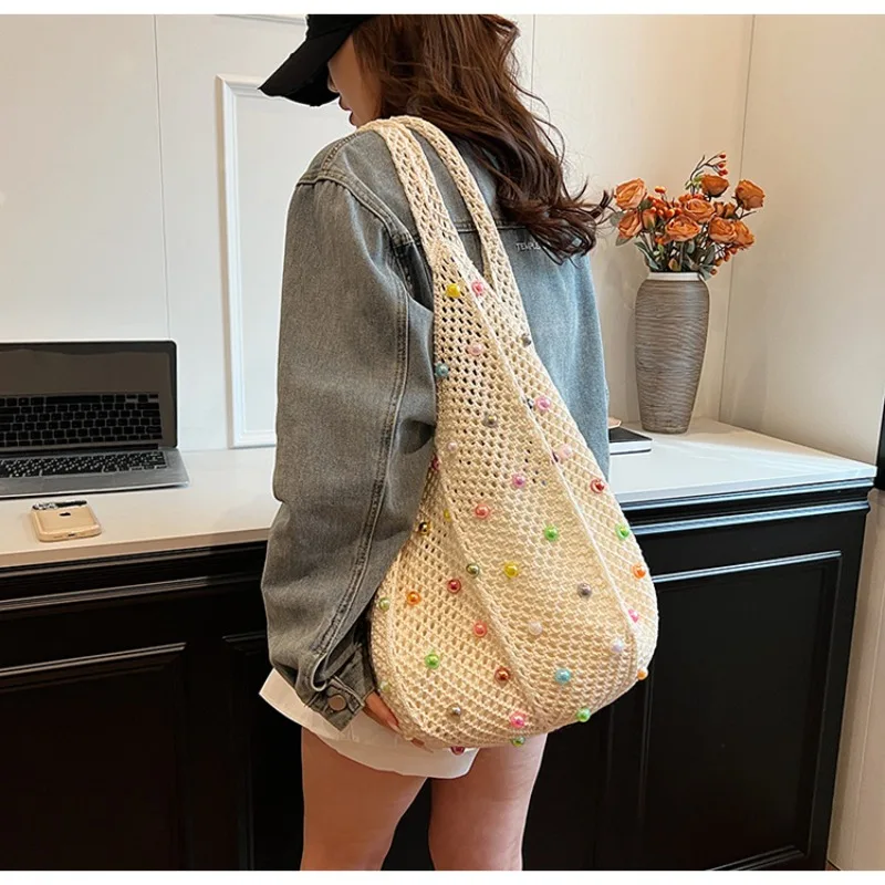 

Lazy Seaside Holiday Woven Bag Female Summer Pearl Hollow Underarm Bag Large Capacity Commuter One-shoulder Tote Bag