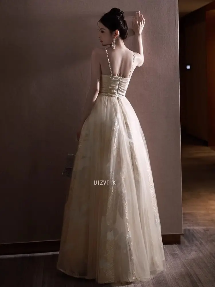 ชุดราตรีแบบไม่มีสายคาดไหล่ แชมเปญ ประดับลายปักดอกไม้สุดหรู ชุดงานเลี้ยงค็อกเทล ผ้าทูลล์คลาสสิก ทรงเอไลน์ยาว ชุดออกงานทางการ