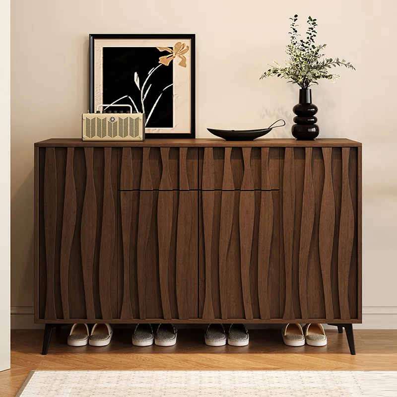 

cabinet at the door of the shoe cabinet, household shoe rack against the wall