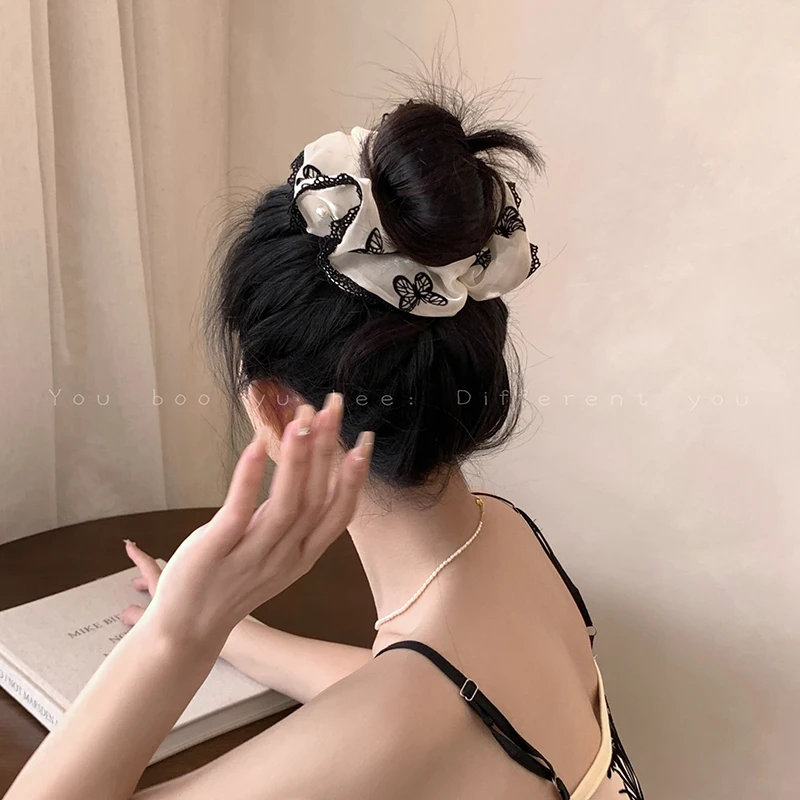 Korean Black Velvet Bow Scrunchie - High-End Hair Accessory, Stylish and Elegant Design.