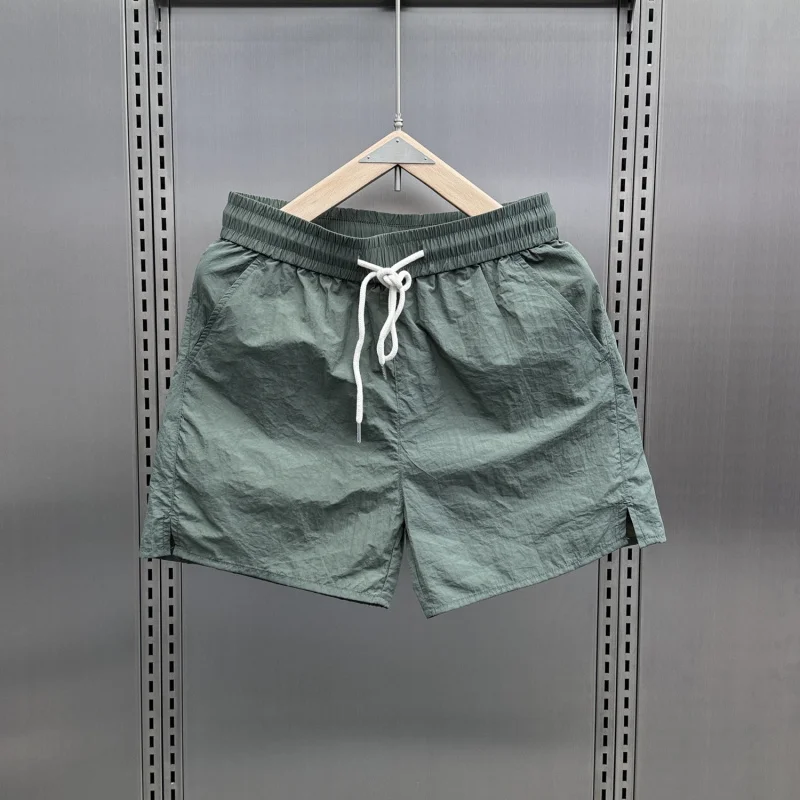 Summer thin, fashionable, breathable and quick-drying shorts for men 2025, casual drawstring solid color beach pants