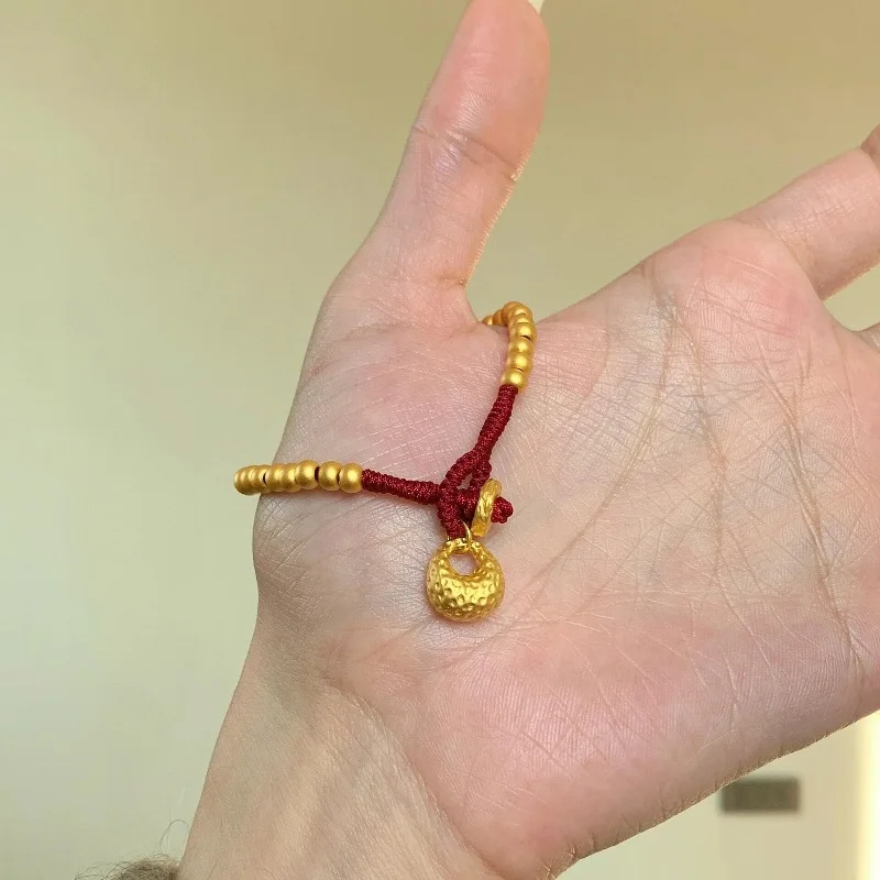 New in antique gold crafts round beads Yuanbao style bracelets red woven rope bag bracelet light luxury simple banquet jewelry view 5