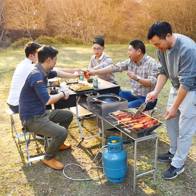 BBQ table, picnic table and chairs, portable mobile kitchen, folding stove, cooker, equipped field stove, car on