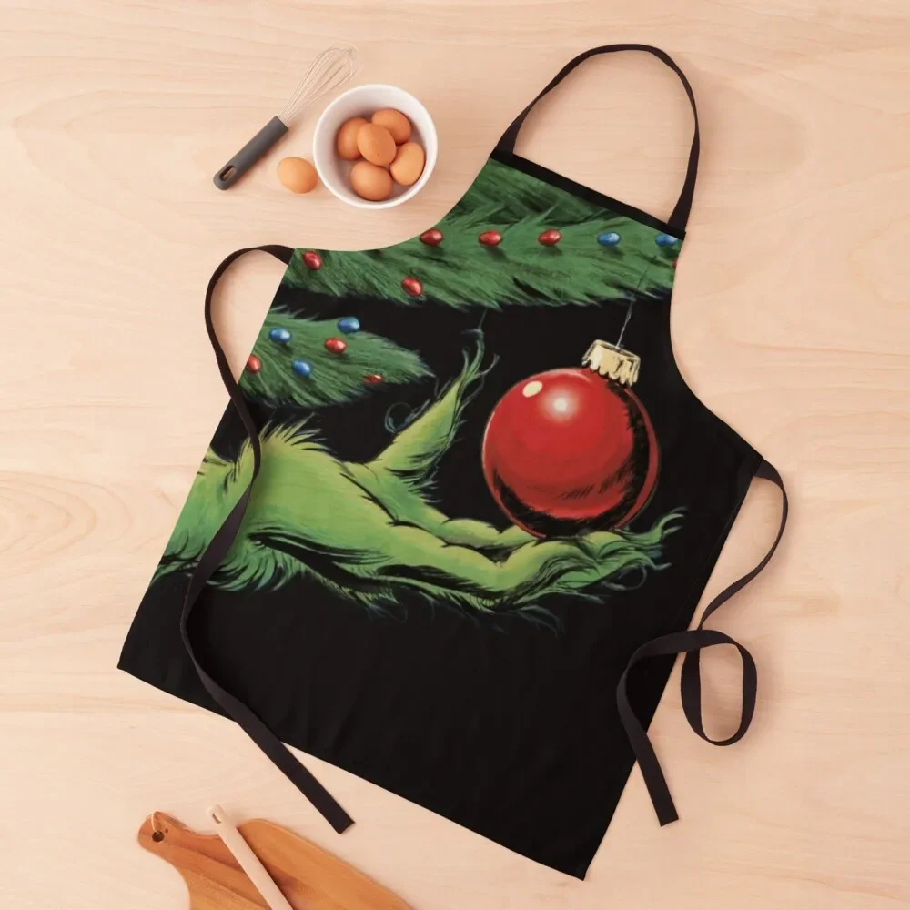 

Green hand grabbing a Christmas bauble Apron Kitchenware Woman Kitchens Cooking Apron